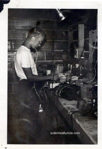 A 1940's black and white photo of my uncle in his basement lab experimenting with test equipment.