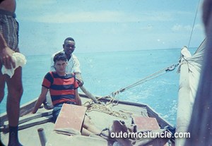 A couple of guys on a sailboat in the Bermuda Triangle , off a Bahamas island in the 1950's. A photo taken by my uncle who disappeared there.