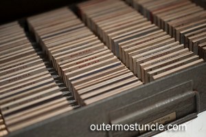 A dusty, old metal box of slides found in a creepy attic.