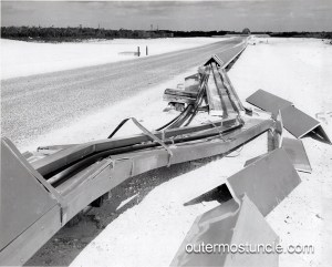 Vintage black and white photo of damage to a cable or some sort of equipment. Cold War era. 