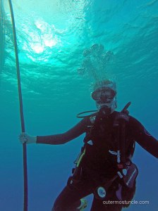 Me on my first SCUBA dive, holding onto the rope below the boat. San Salvador Island, Bahamas. 2024.