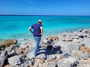 Cousin John, walking away along the rocks at the place where our uncle disappeared in 1958. San Salvador Island, Bahamas.