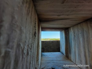A photo, looking out from an access hole of the weird, round Cold War era building. North Beach, San Salvador Island, Bahamas.