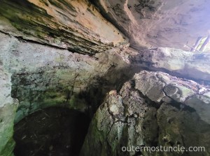 A big ol' crack in the rock, that has steps, going down past where the eye can see. Watlings Castle. San Salvador Island, Bahamas.