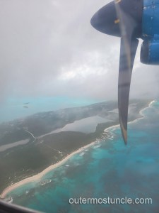 A color photo taken out the window of the aircraft over the Bahamas.