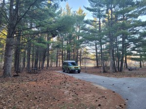A color photo of a Honda Element Ecamper at a campsite in Wisconsin.