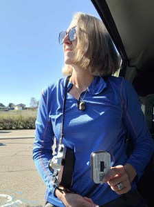 A self portrait on the road. Me with my Pentax Spotmatic and a Pintoid pinhole camera.