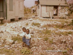 Two  little boys in a yard. 1950's Bahamas.