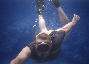 A color photo of a man underwater with snorkel gear. Taken by Uncle Bill circa 1958 in the Bahamas.