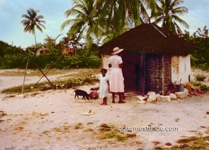 A women, tuned away, and a small girl. Bahamas. 1950's.