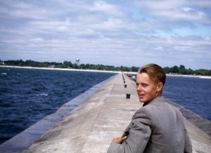 A young man, Dick Palmer, looks back over his shoulder at the photographer.