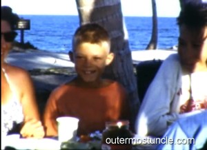 A young boy at a picnic table.