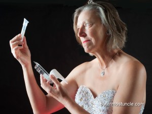 Me, wearing a sequin gown and looking at my DNA test kit.