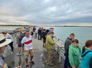 The croud gathered on the pier at Jetty Park Launch Viewpoint.