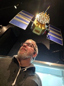 John Langer and his satellite - on display at the Sands Space Museum. The satellite is on display. Not John.