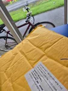 The package at the post office, with my bicycle in the background.