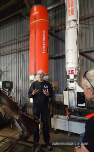 Jorgen stands in front of a couple of rockets that Copenhagen Suborbitals has launched.