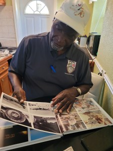 Huel Williamson looks at photos taken on the Eastern Test Range in the 1950's.