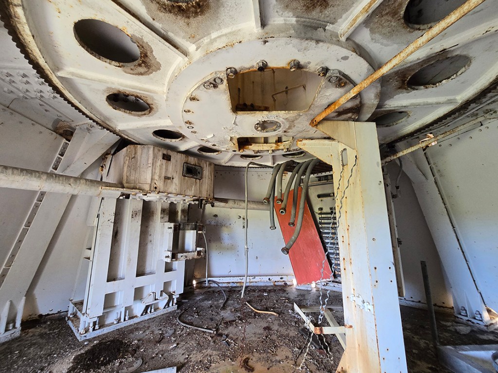 Inside the upstairs, just beneath the dish. I find out later that an owl lives here. 